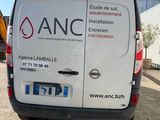 a van that is parked in front of a building