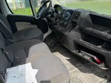 a picture of the inside of a van with the driver ' s seat down