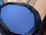 a black table with a blue lid sitting on a carton