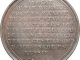 an old silver coin with writing on it on a white background