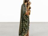 an image of a statue of jesus holding a baby jesus