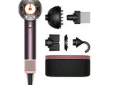 an image of a hair dryer with a hair clipper and other accessories