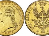 une pièce de monnaie « sovereign » en or, sur laquelle figurent une couronne et un aigle
