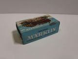 a blue box with a train on it sitting on a table