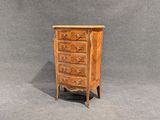 une image représentant une petite commode en bois sur fond gris