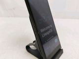 a cell phone that is sitting on top of a stand