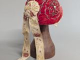 an image of a red hat with a bow on top of it
