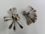 a lot of silver spoons and spoon spoons on the table