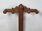 an old wooden cross with a stone in the middle of it