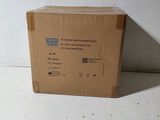 a box that is sitting on the floor in front of a wall