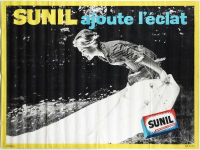 black and white photograph of a woman on a surfboard in the sun