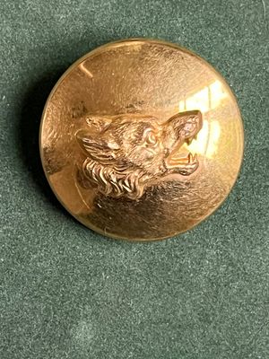 une pièce d'or sur laquelle est représenté un chien