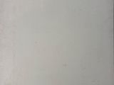 a picture of a white refrigerator with a yellow sticker on it