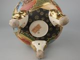 a small vase with a design on it on a table