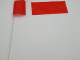 flag of denmark on a stick on a white surface