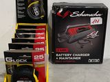 a box of batteries and a charger on the floor