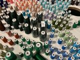many spools of thread sitting on a table