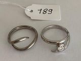 two silver rings and a tag with a price tag on them