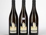 three bottles of wine sitting next to each other on a table