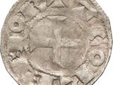 Gros plan sur une pièce de monnaie portant une croix