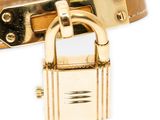 an image of a gold bracelet with a padlock on it