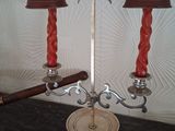 two lamps that are on a table with a baseball bat