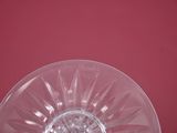 a clear glass plate with a flower design on it