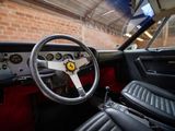 a steering wheel and dashboard of a car in a garage
