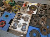 many different types of metal parts on the table