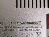 a close up of a silver electronic device on a table