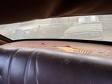 a dirty seat in the back of a car