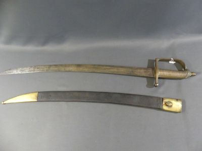 pair of antique swords with brass fittings on a gray background