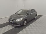 a picture of a grey car parked in a garage