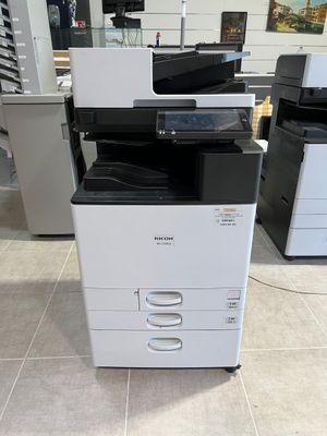 a printer that is sitting on the floor in a room