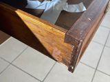 a piece of paper in the drawer of a wooden table