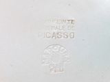 a close up of a white plate with a logo on it