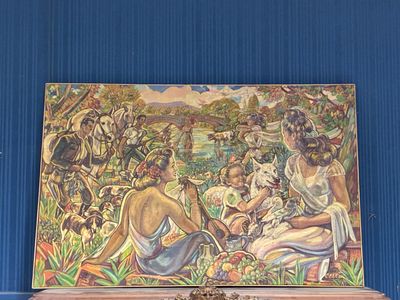 un tableau accroché au mur d'une pièce aux murs bleus