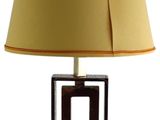 a lamp that is on a table with a lamp shade on it