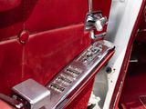 a close up of a red car door handle and door handle
