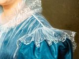 portrait of a woman in a blue dress with a white lace collar