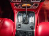 an image of a car dashboard with red leather seats