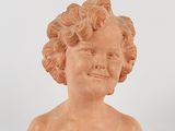 an image of a statue of a child ' s head on a white surface