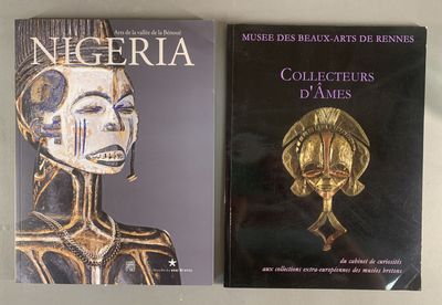 two books on a table with one of them in gold and the other in black