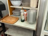 a shelf that has many items on it in the kitchen