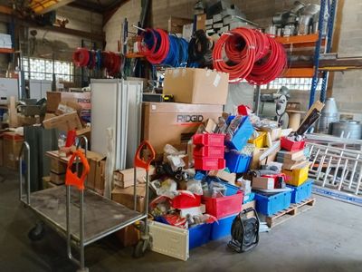 a large pile of assorted items in a warehouse