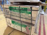 a large stack of plywood boards on a pallet