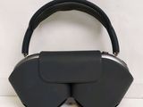 a black purse that has a pair of glasses on top of it