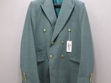a green jacket hanging on a hanger on a wall