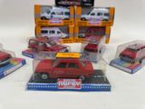 five toy cars in a display case on a table