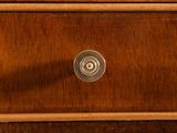a close up of a drawer with a clock on it